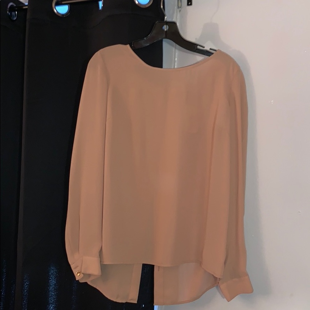 Light peach blouse .